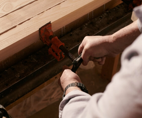 Person using tool in workshop